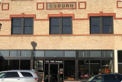 Historic Osborn brick building with new storefront windows in downtown Sidney