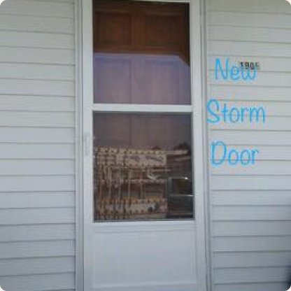 White storm door with a full glass panel on a home entrance